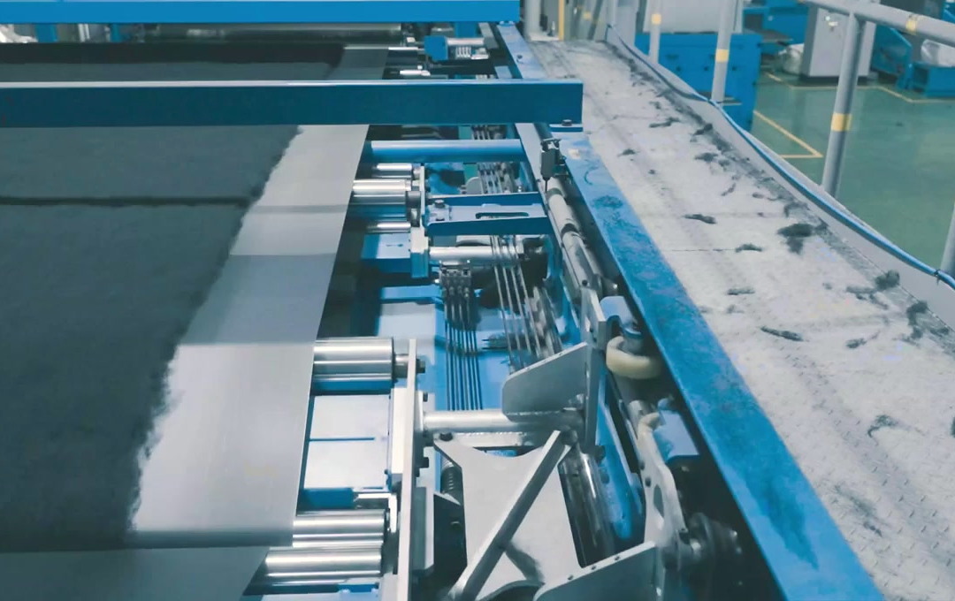 Fiber web running through the coating line